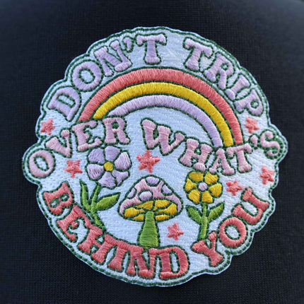 Don’t Trip Over What’s Behind You | Trucker Hat